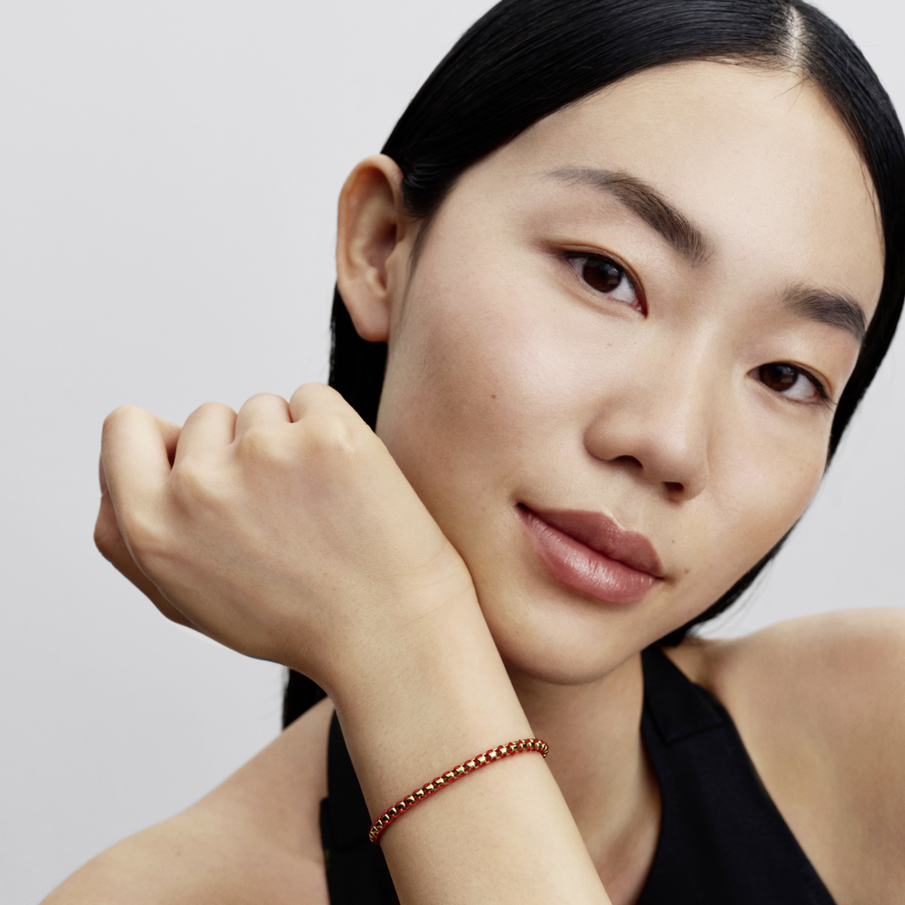 Braided 14k gold-plated box chain bracelet with red textile cord