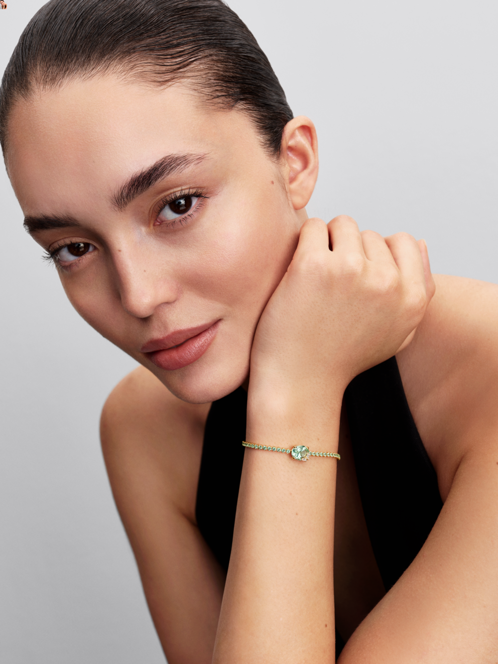 Butterfly 14k gold-plated slider tennis bracelet with pastel green crystal and clear cubic zirconia