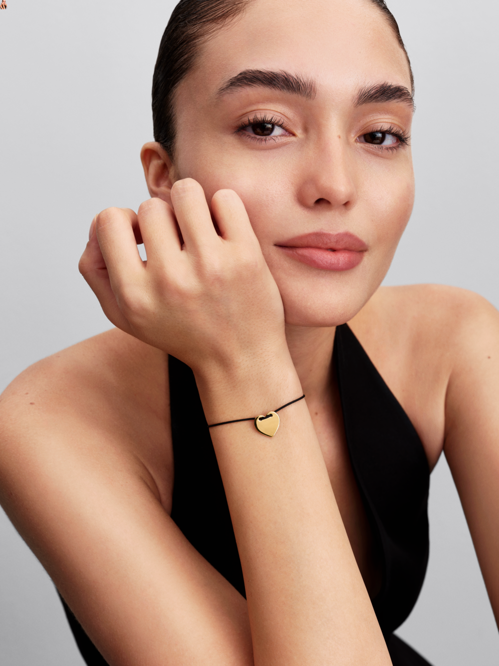 Engravable heart 14k gold-plated sliding bracelet with black nylon