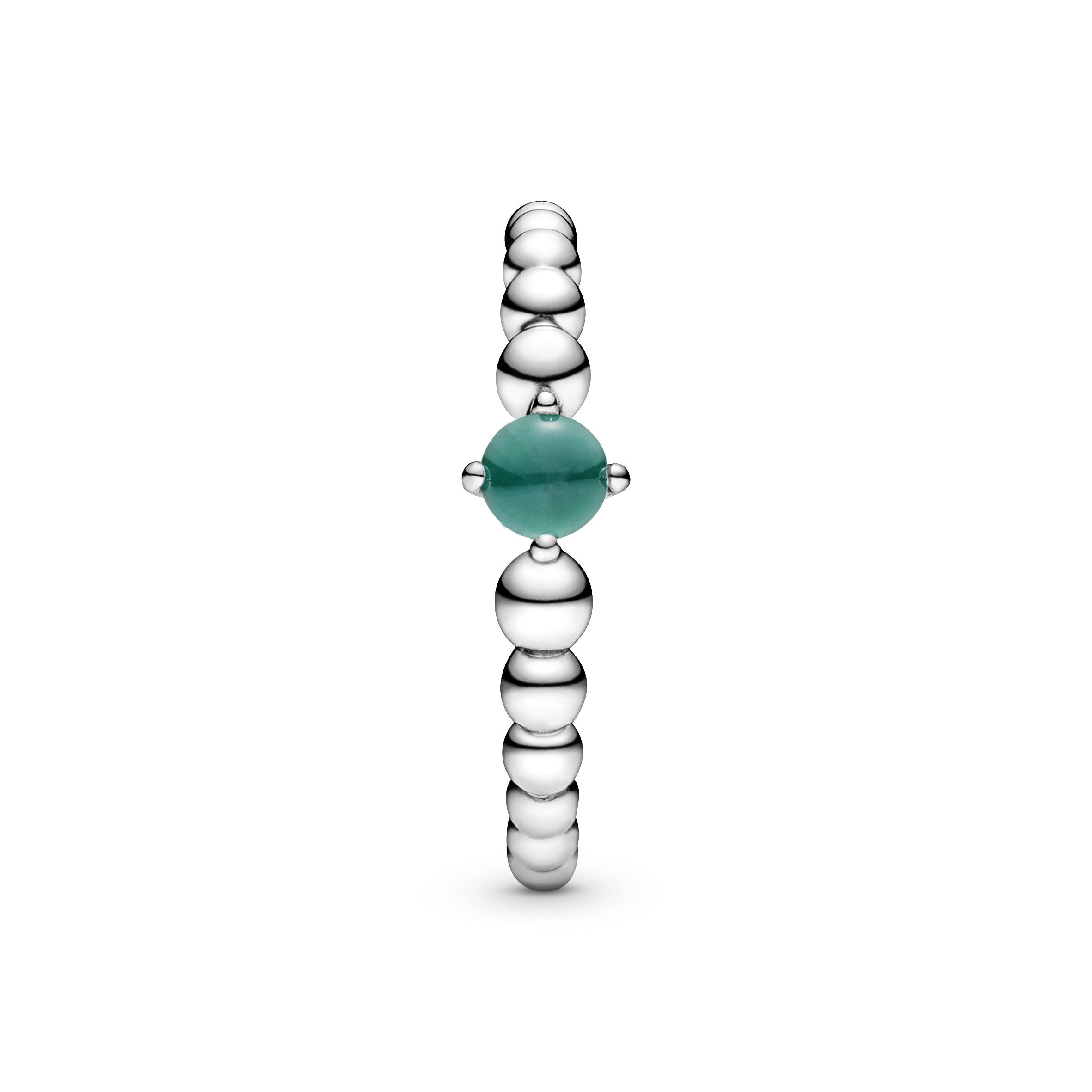 Sterling silver ring with treated rainforest green topaz