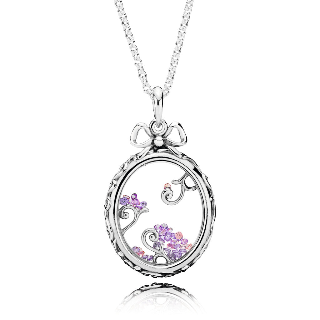 Regal pattern locket silver pendant with fancy pink, fancy purple and purple cubic zirconia
