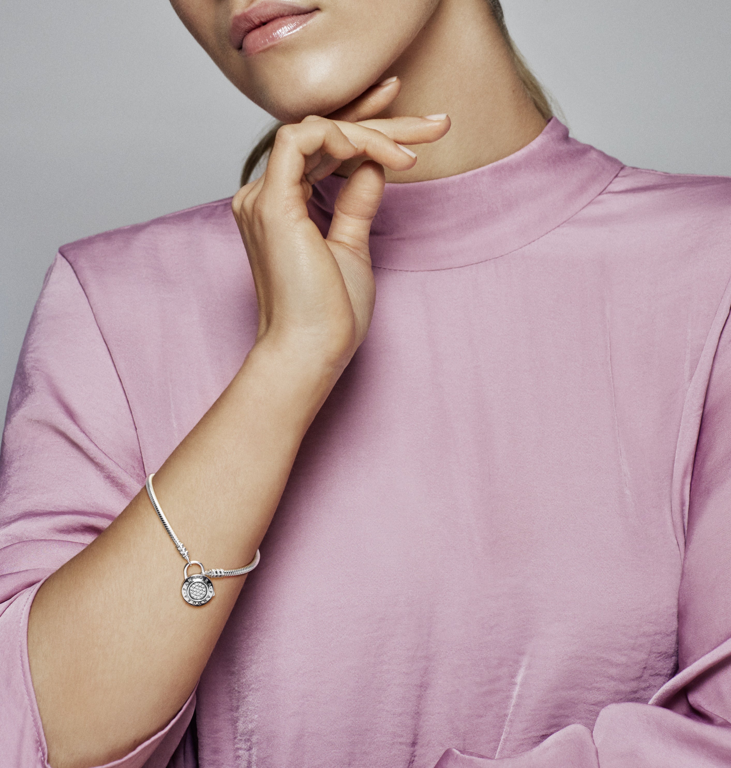 Snake chain silver bracelet and PANDORA logo padlock clasp with clear cubic zirconia