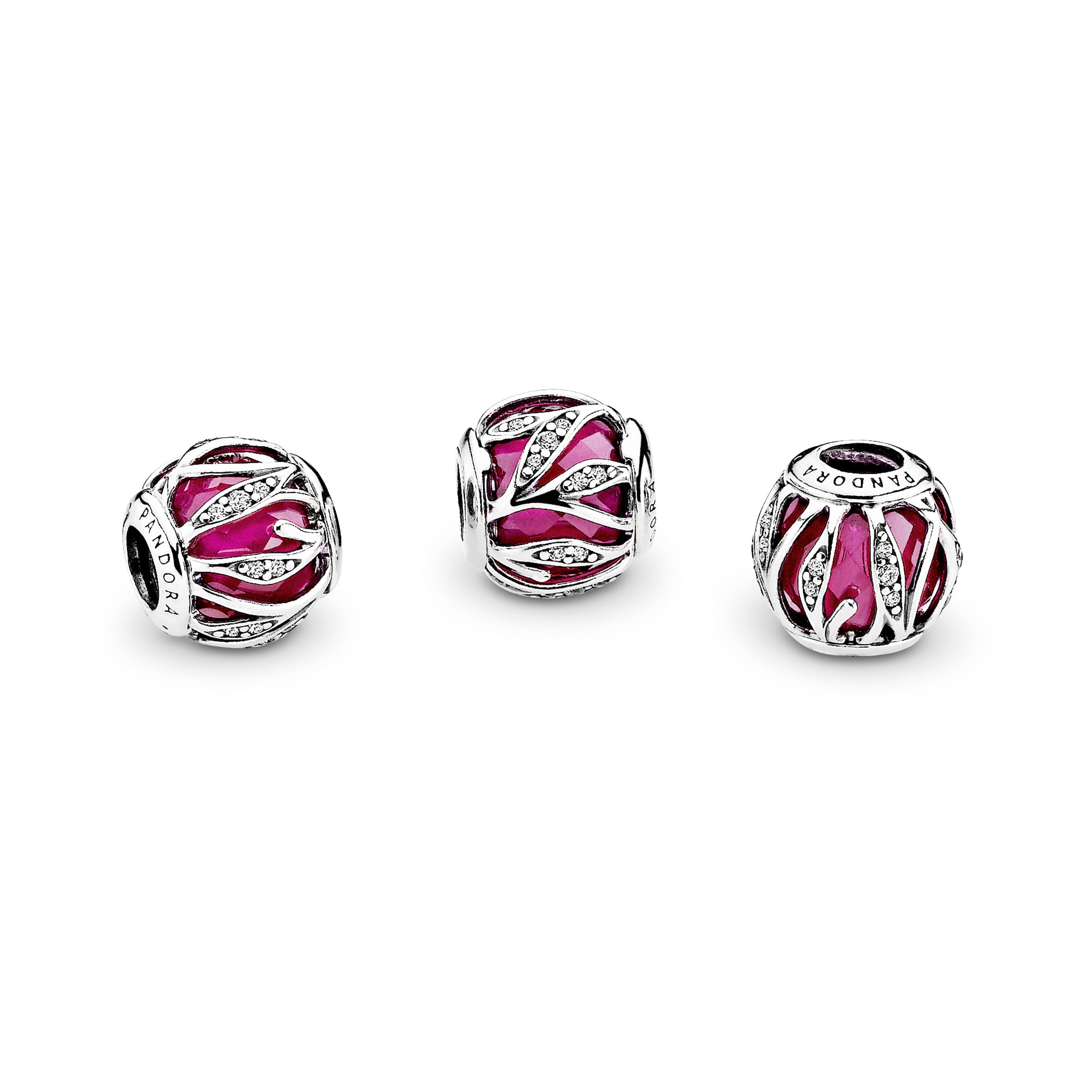 Abstract silver charm with faceted synthetic ruby and clear cubic zirconia