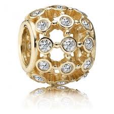 Openwork abstract gold charm with cubic zirconia