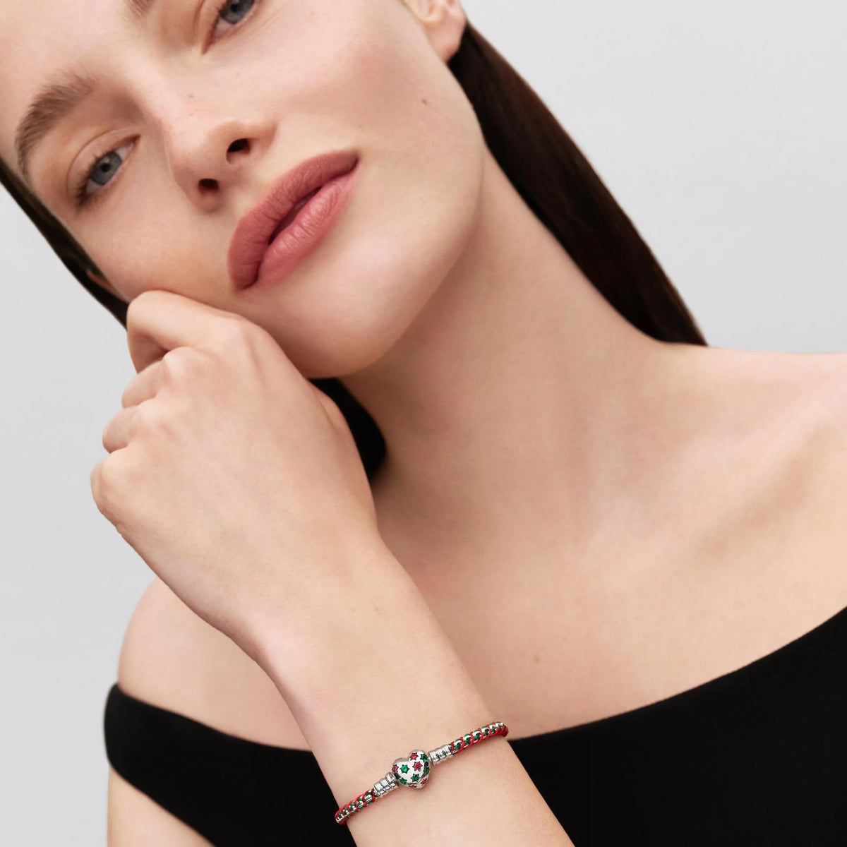 Braided sterling silver box chain bracelet with red cubic zirconia, royal green crystal, red and green cord