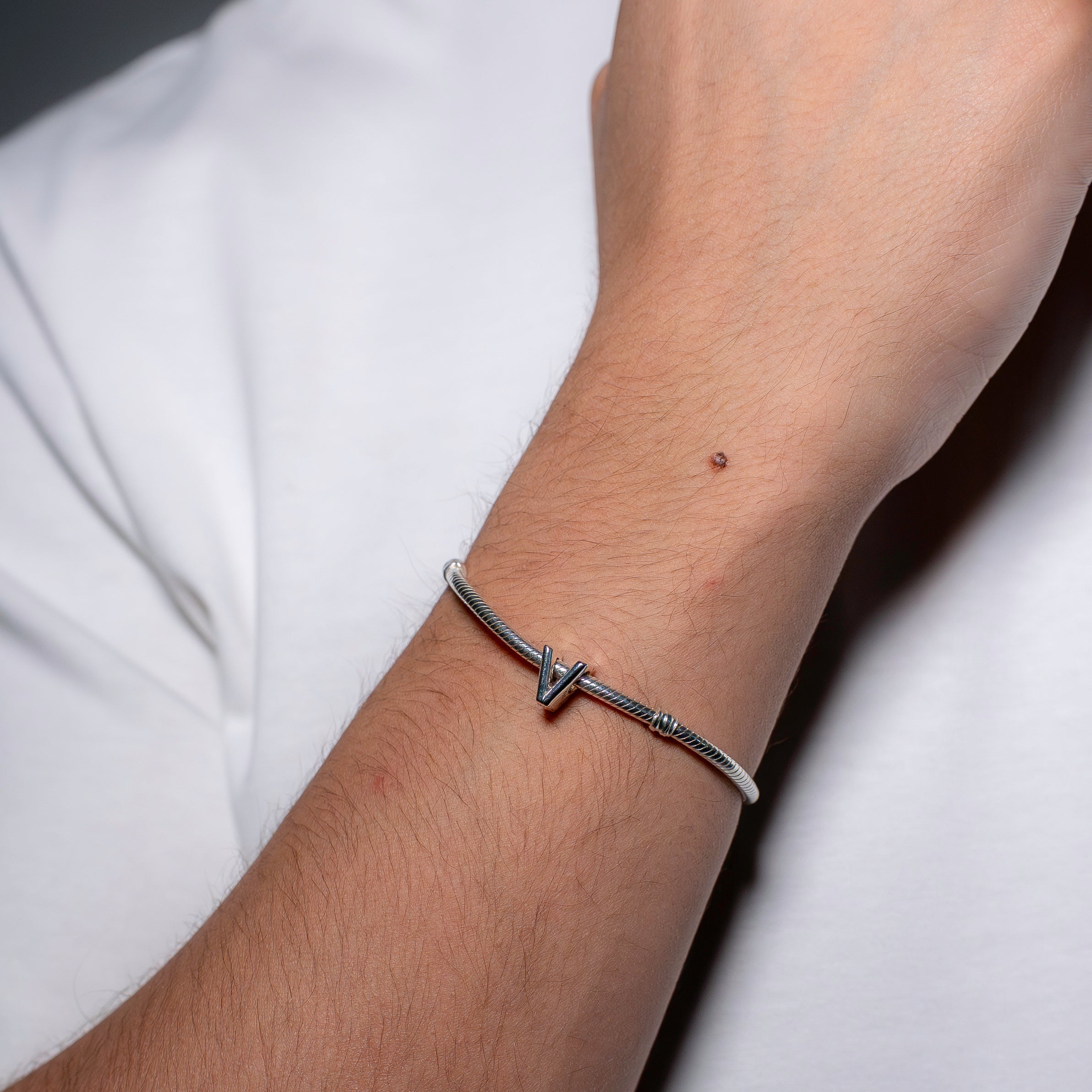 Letter V silver charm