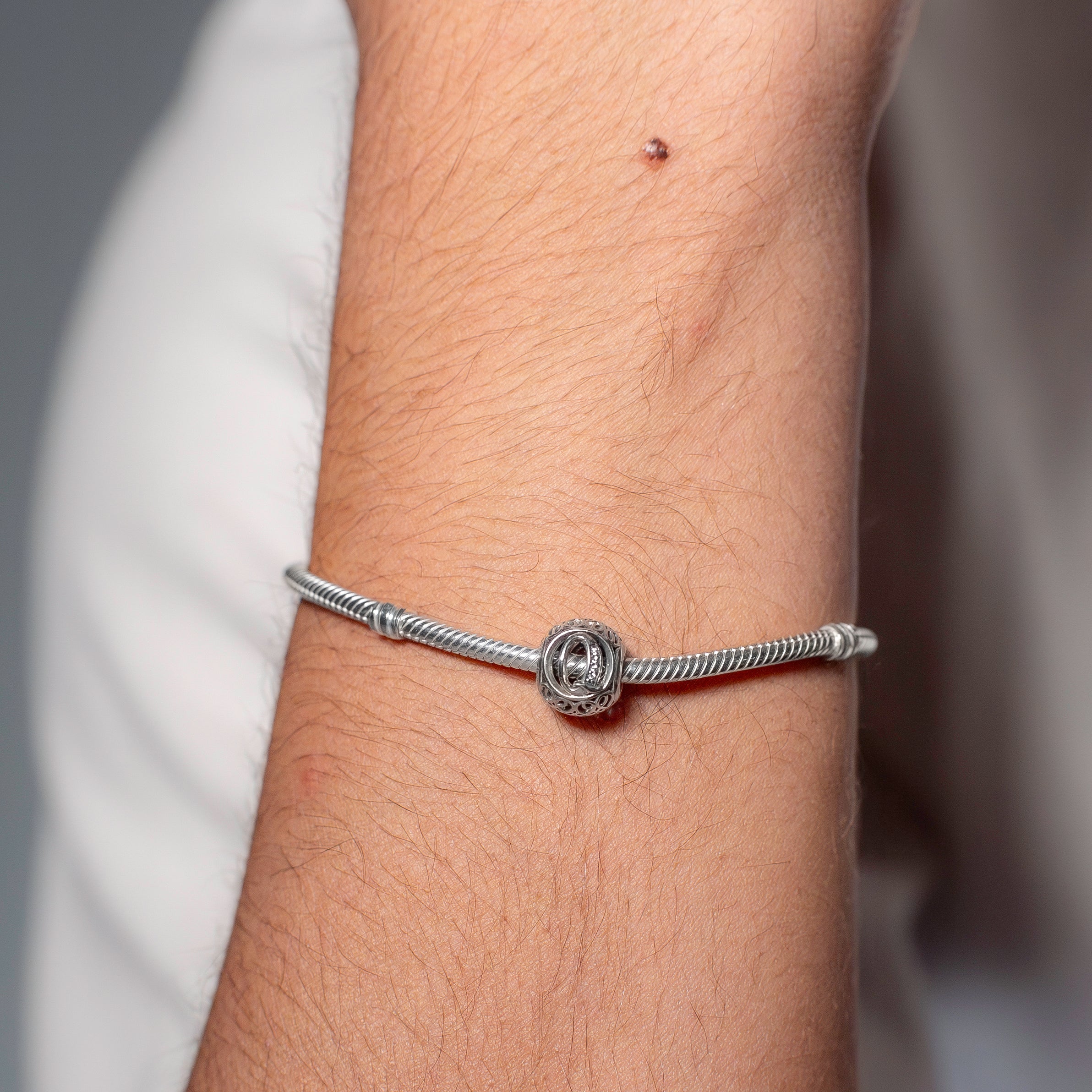 Letter Q silver charm with clear cubic zirconia