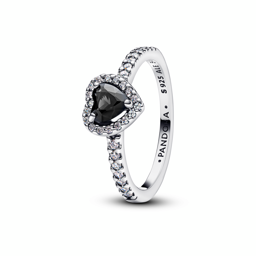A bold black heart stone sits at the center of this striking ring, framed by shimmering pavé