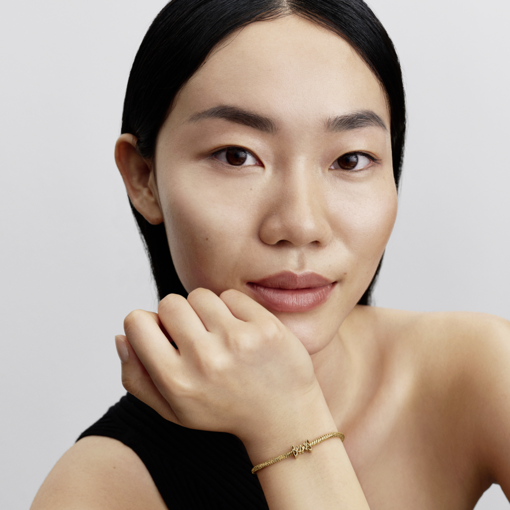 Besos 14k gold-plated charm