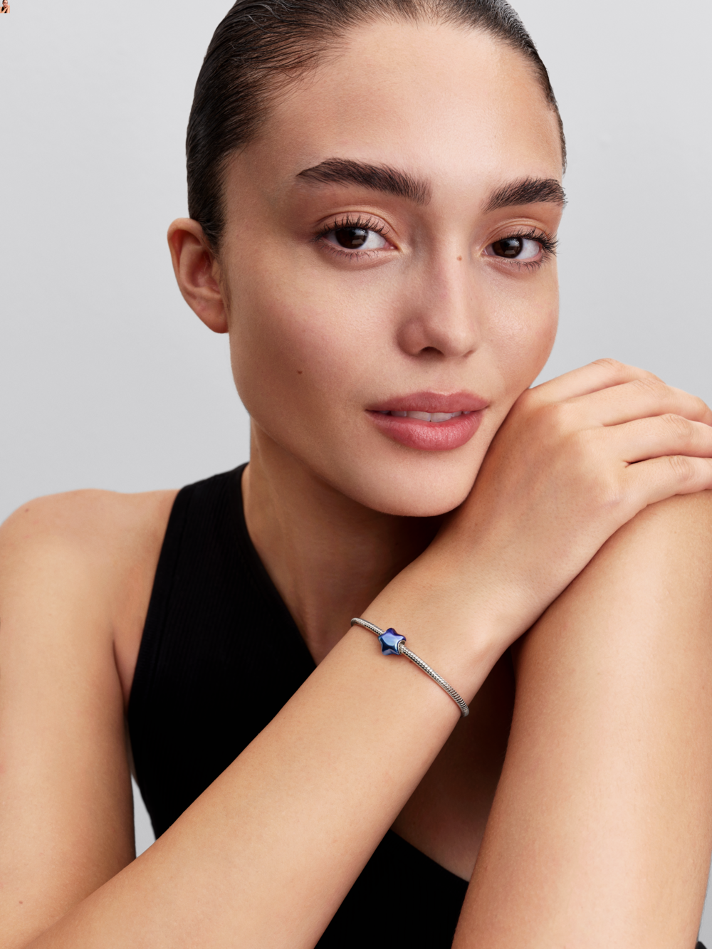 Puffy star sterling silver charm with blue enamel