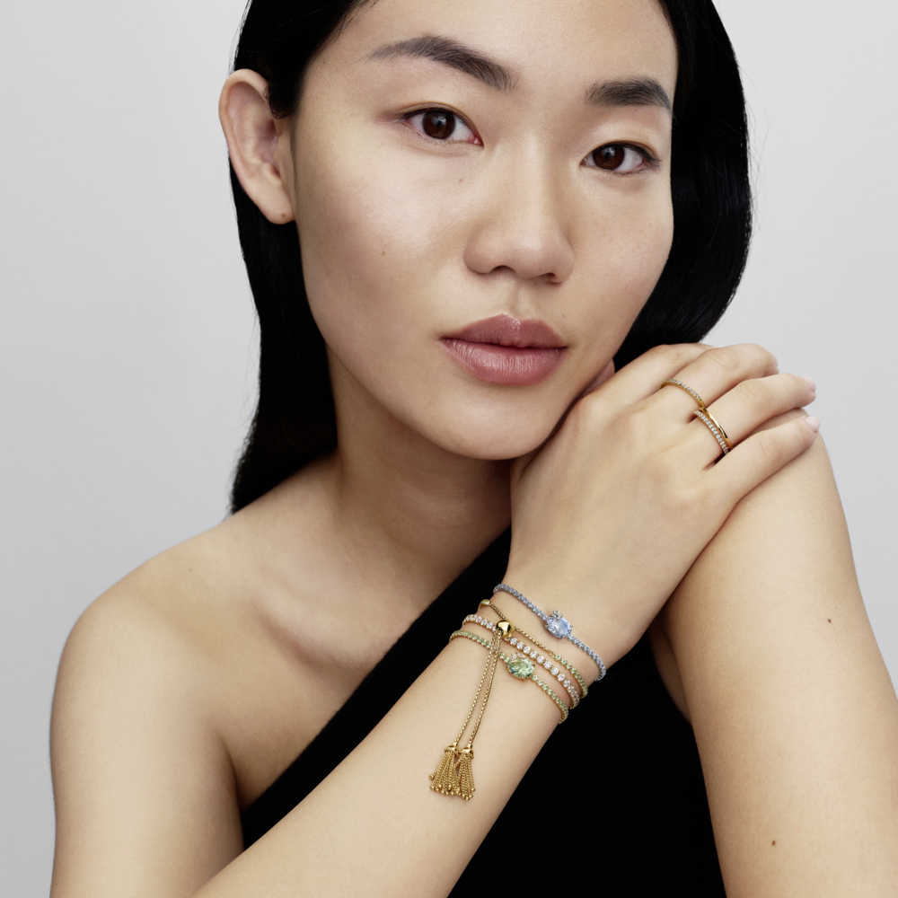 Butterfly 14k gold-plated slider tennis bracelet with pastel green crystal and clear cubic zirconia