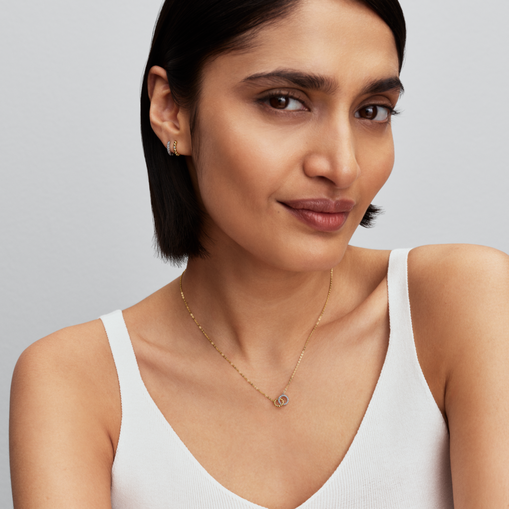 Sterling silver huggie hoop earrings with clear cubic zirconia