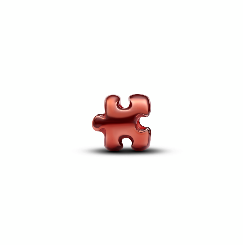 Puzzle sterling silver mini charm with orange enamel