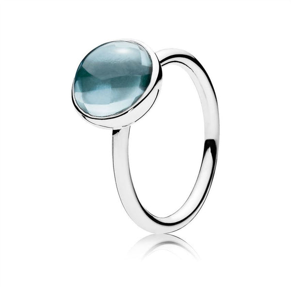 Silver ring with aqua blue crystal