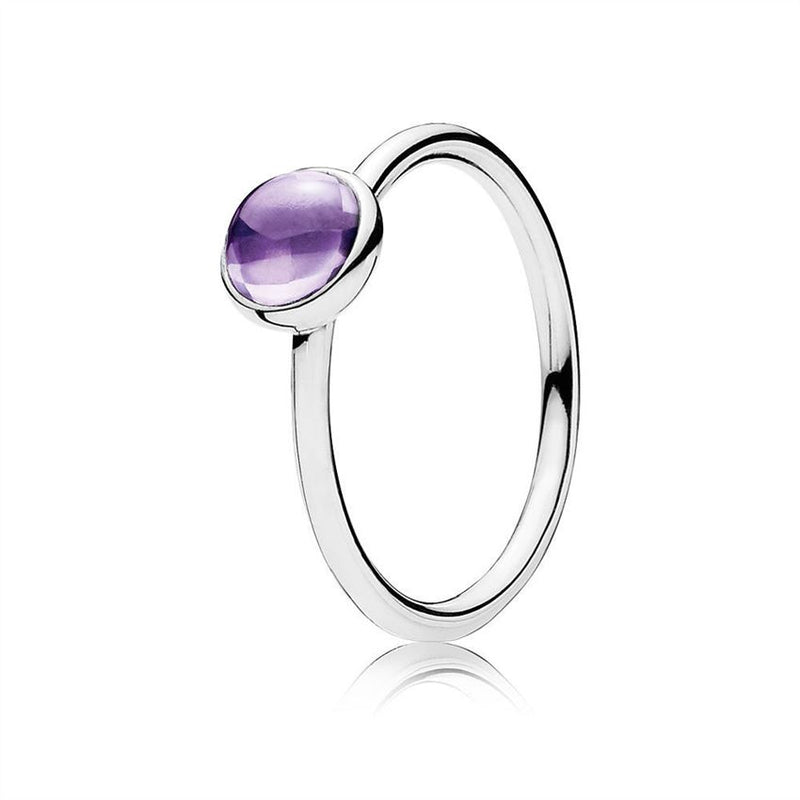 Silver ring with purple cubic zirconia