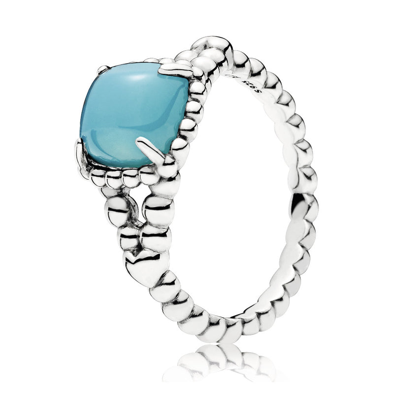 Silver ring with scuba blue crystal