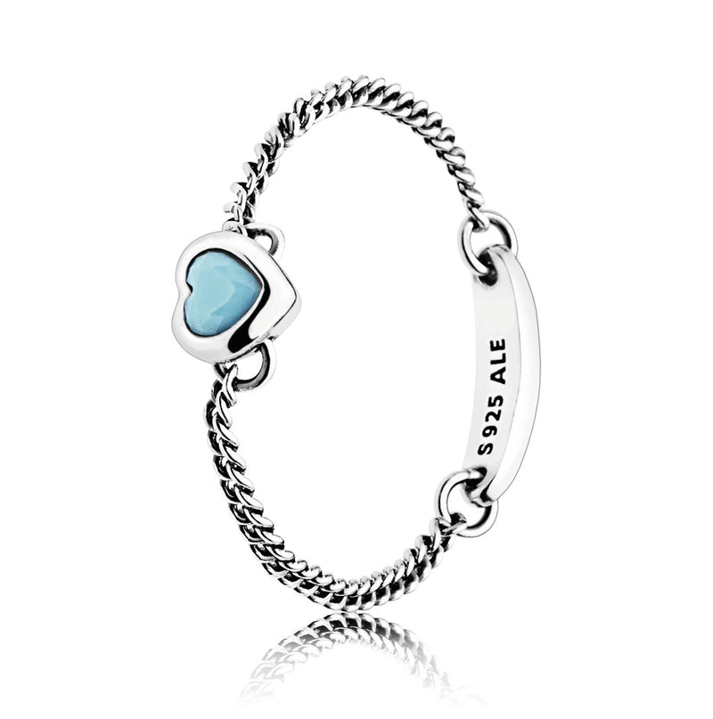 Silver chain ring with cyan blue crystal