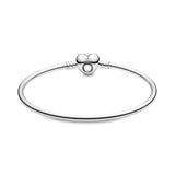 Silver bangle with heart-shaped clasp
