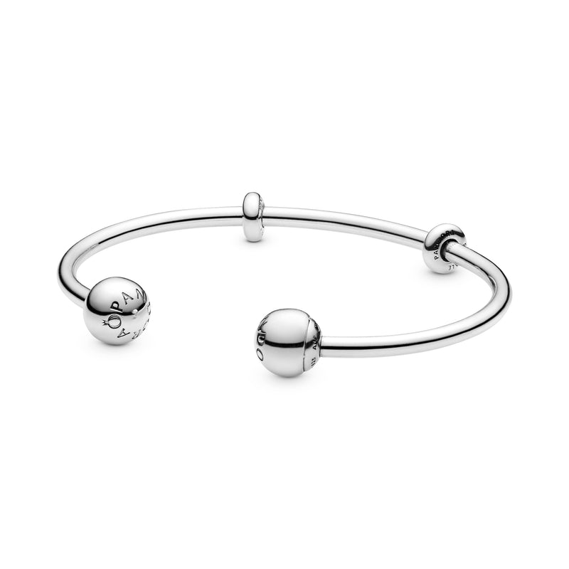 Silver open bangle with silicone stoppers and interchangeable end caps