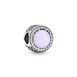 Abstract silver charm with opalescent pink crystal and clear cubic zirconia