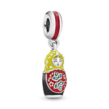 Matryoshka silver dangle with red, black, yellow and green enamel