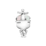 Boy silver charm with pink and green enamel