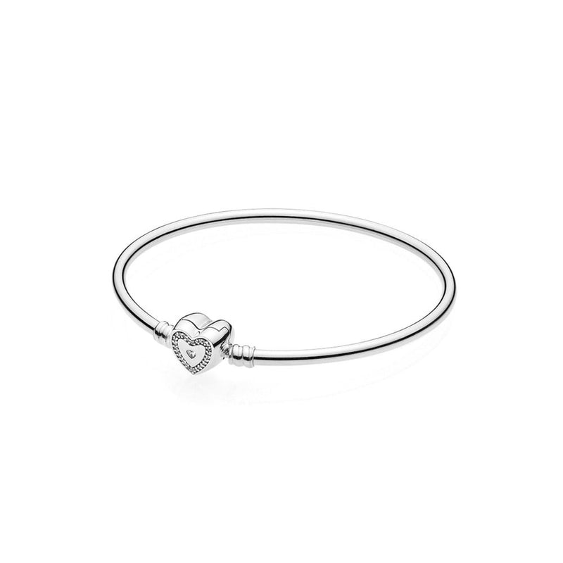 Silver bangle with heart-shaped clasp and clear cubic zirconia